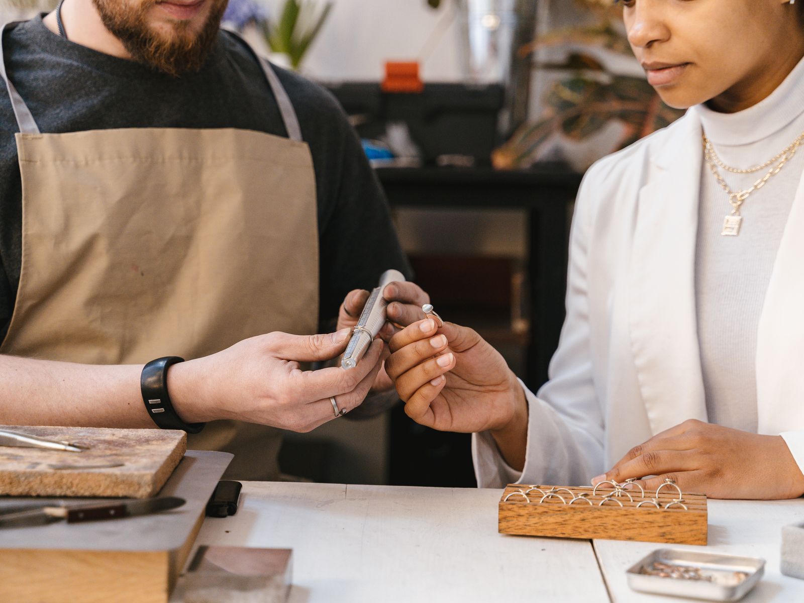 Two makers working together at a studio bench, mid-project.